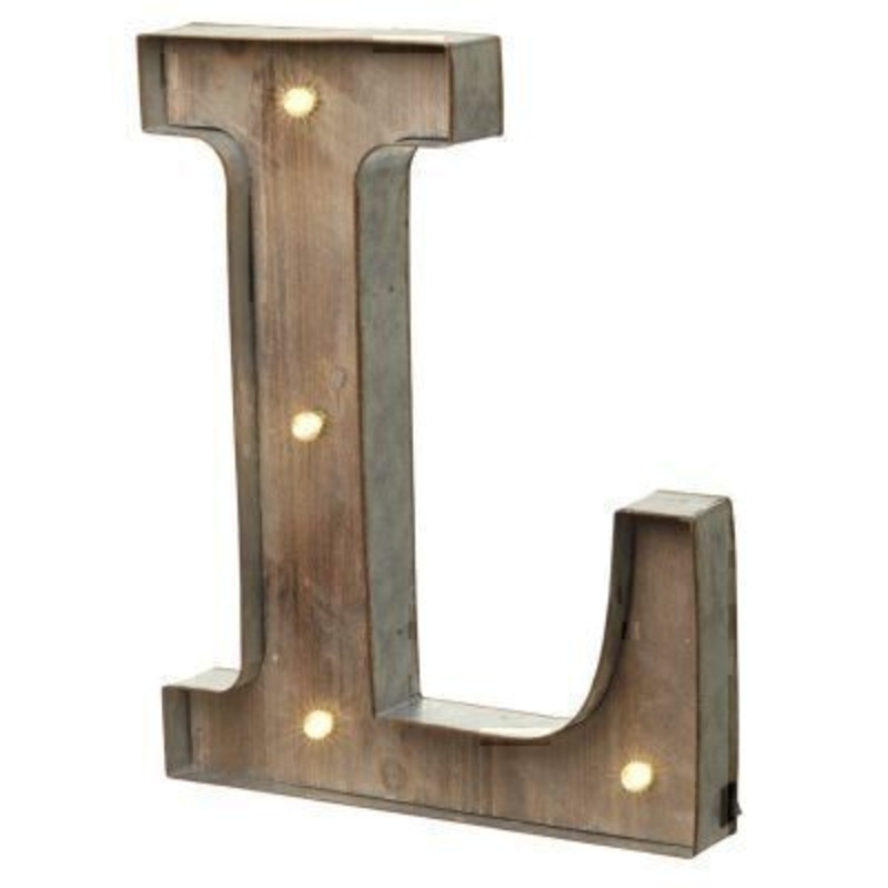This L Sign With LED Lights by Heaven Sends could be paired with other letters to create a bespoke initial sign for a couple or to be displayed on its own. Large in size this & sign has got LED lights and a switch on the side to turn it on. Made from wood and metal. Size: 32x5x41cm